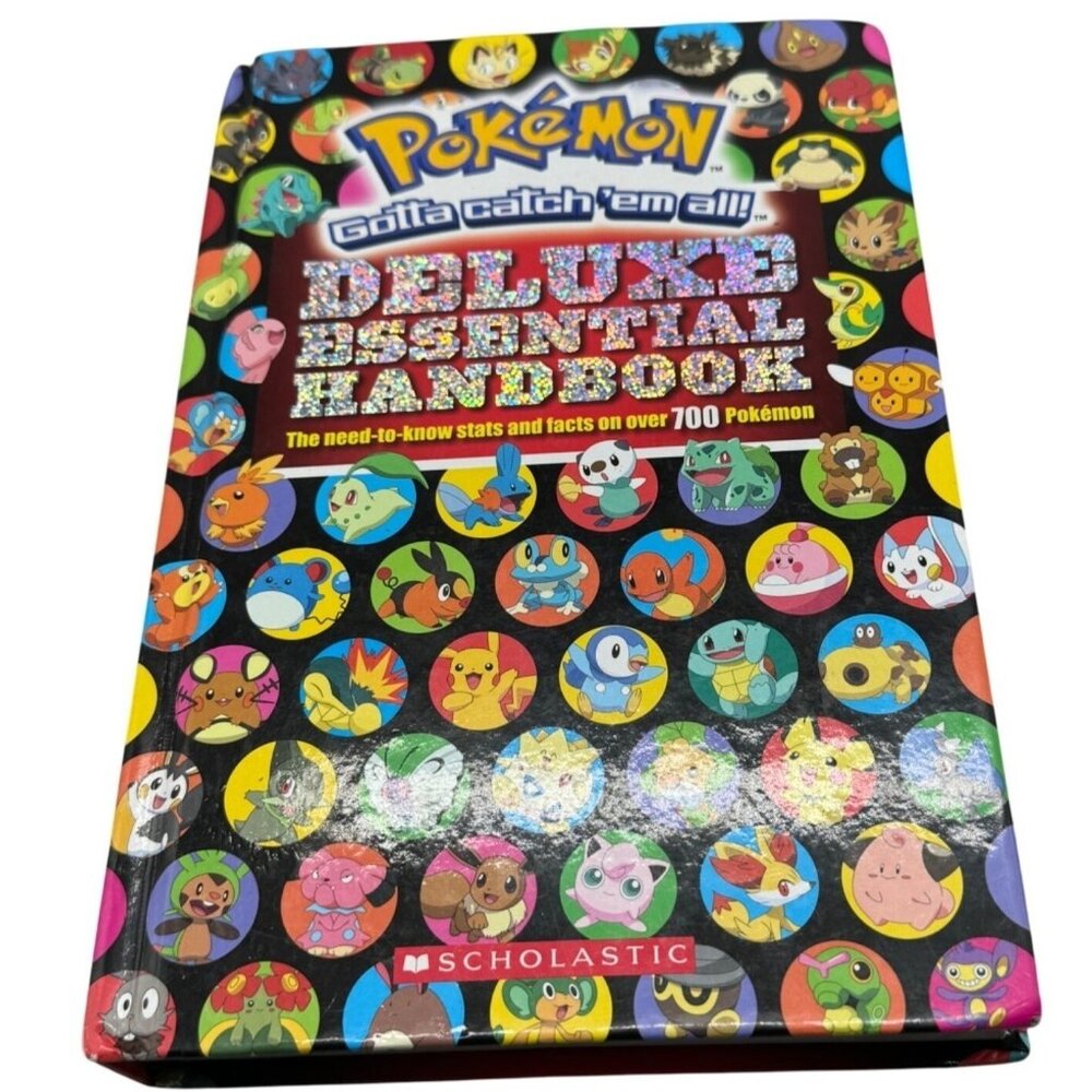 Pokemon gotta catch'em all deluxe essential handbook hardcover scholastic READ